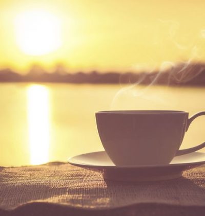 Silhouettes of sunrise morning coffee with hot steam